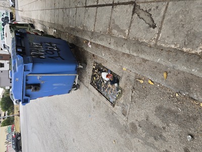Blocked storm drain.  	Κων/νου Καραμανλή  (Φραγμένη αποχέτευση ομβρίων υδάτων.)