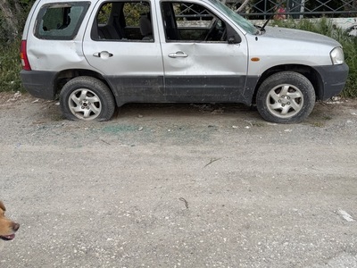 εγκαταλειμμενο οχημα στην παραλια κρηνης  ταβέρνα "ΧΑΡΑ"