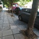 Κατεστραμένες πλάκες πεζοδρομίου  Αριστοτέλους (αριθμός 3 ως 7 περίπου, από Περικλέους ως Αριστείδου)